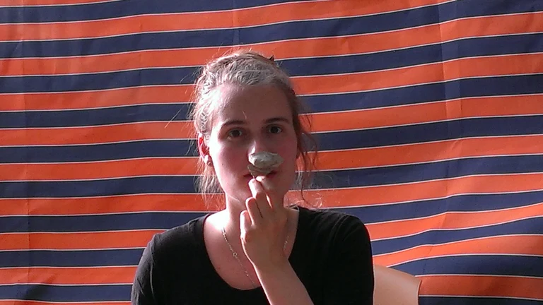 Anna Abdulaziz at pottery reading sporting a jar handle.jpg