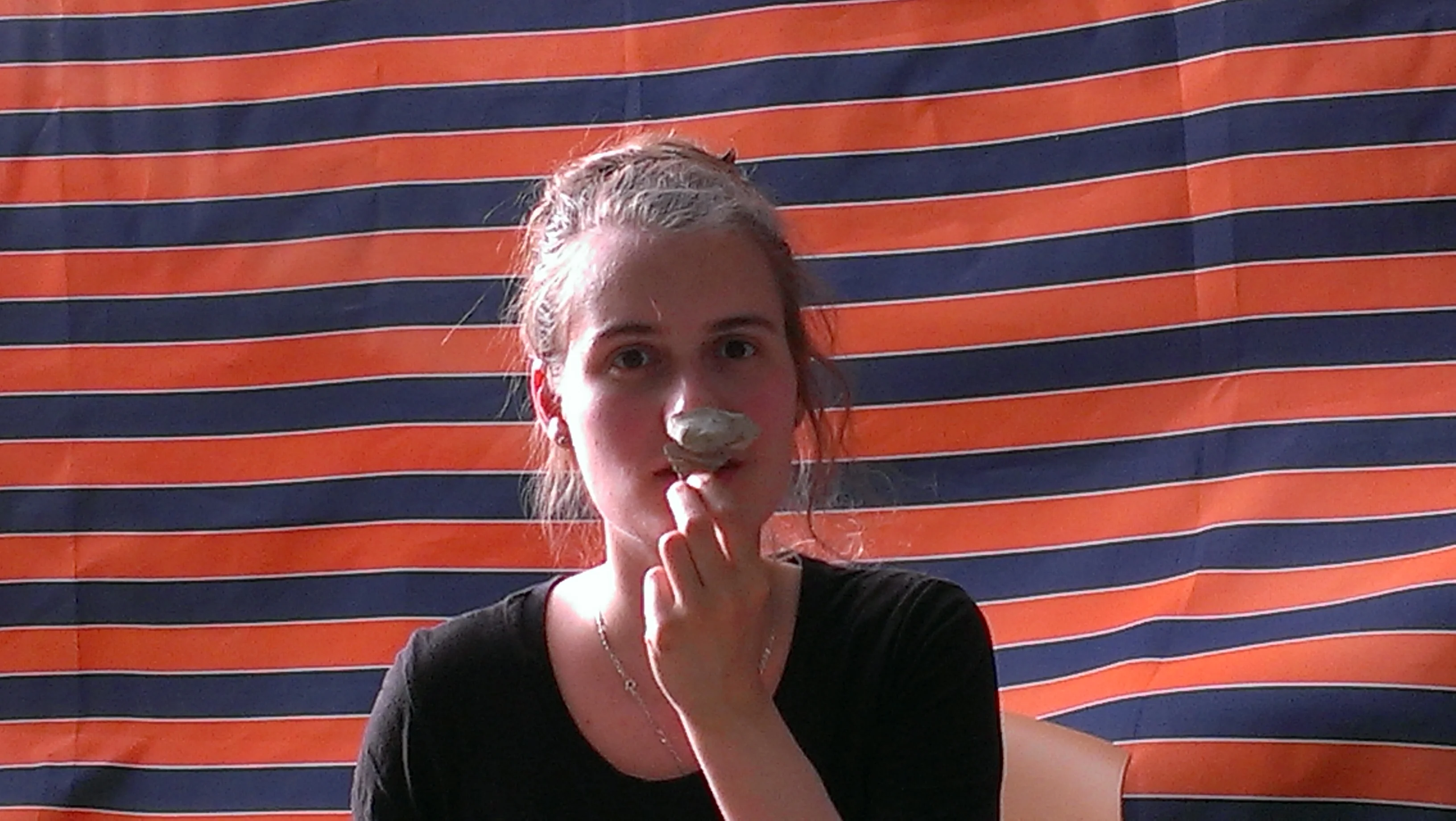 Anna Abdulaziz at pottery reading sporting a jar handle.jpg