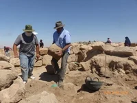 Warren Schultz moving rock.jpg